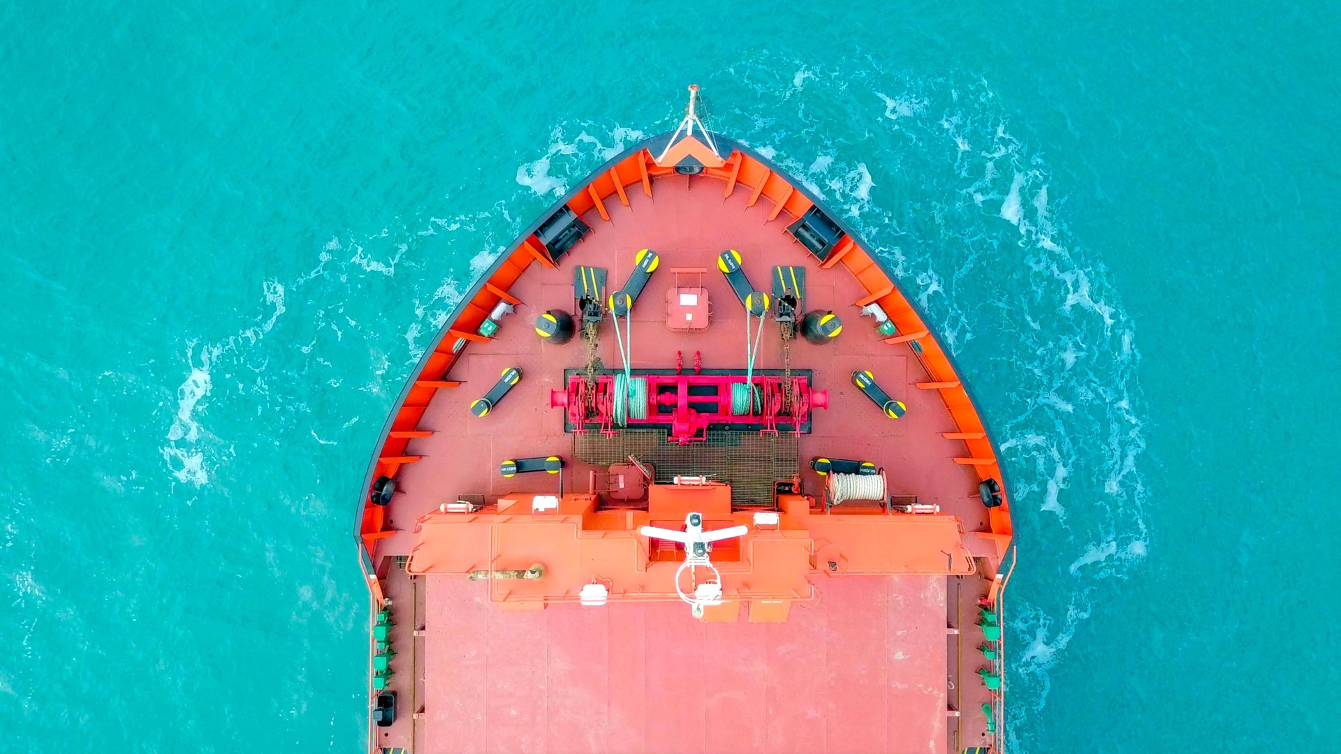 Large Red general Cargo ship anchored at sea